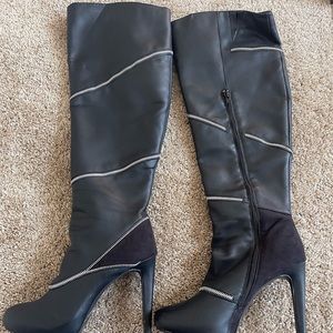 Black knee hi boots with zipper detail